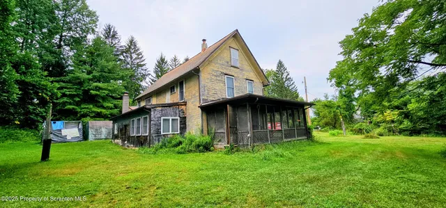 a view of a back yard of the house