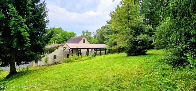a view of a backyard with a garden