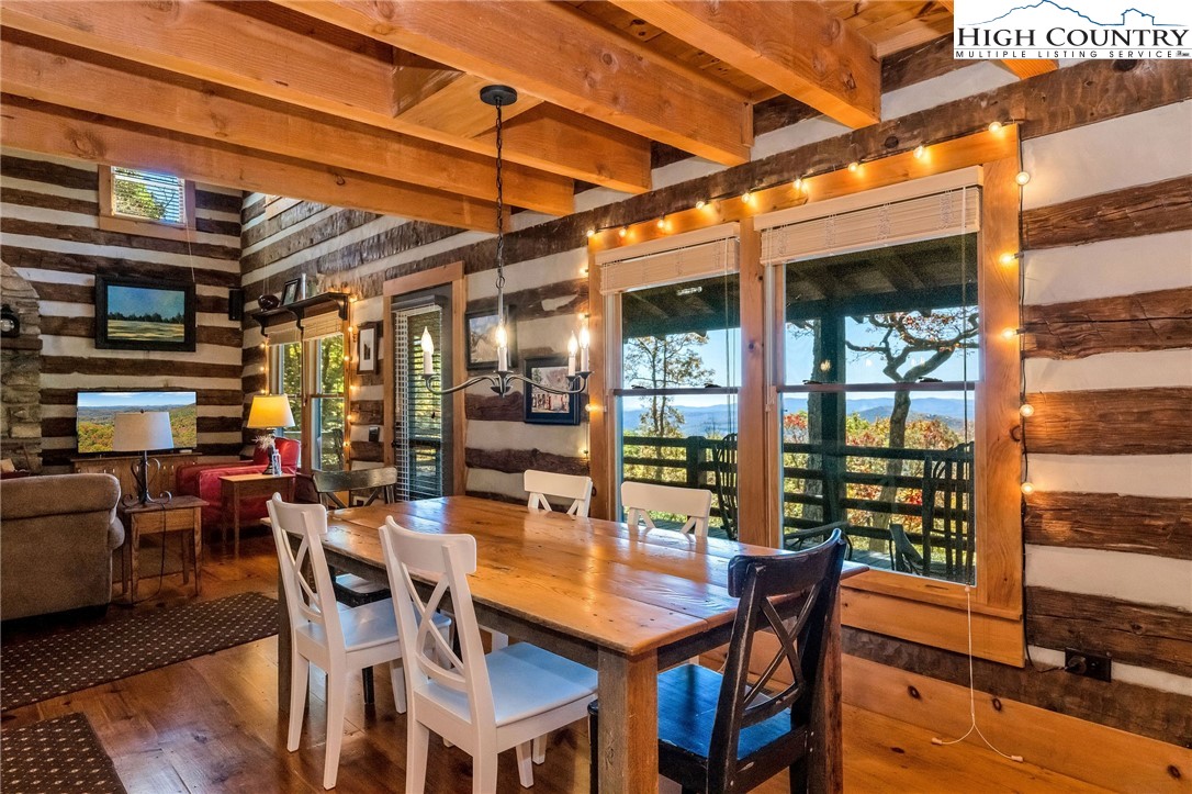 1810 Homestead Road Todd, NC 28684 - Photo 16 of 50 a view of a dining room with furniture window and outside view
