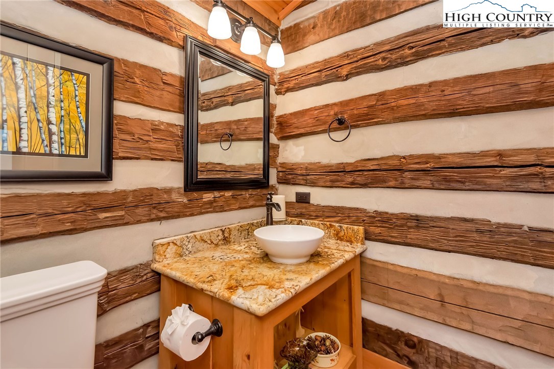 1810 Homestead Road Todd, NC 28684 - Photo 18 of 50 a kitchen with a stove and a sink
