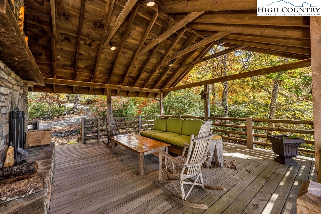 1810 Homestead Road Todd, NC 28684 - Photo 22 of 50 a view of a patio with wooden floor