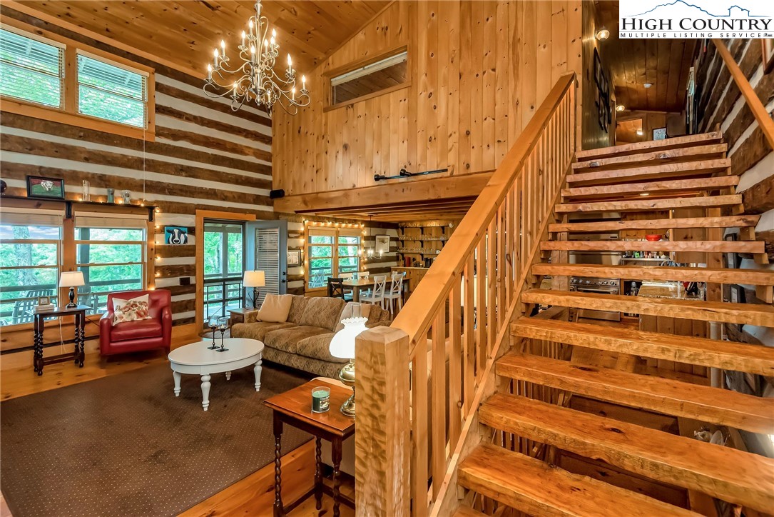 1810 Homestead Road Todd, NC 28684 - Photo 28 of 50 a living room with furniture and a flat screen tv