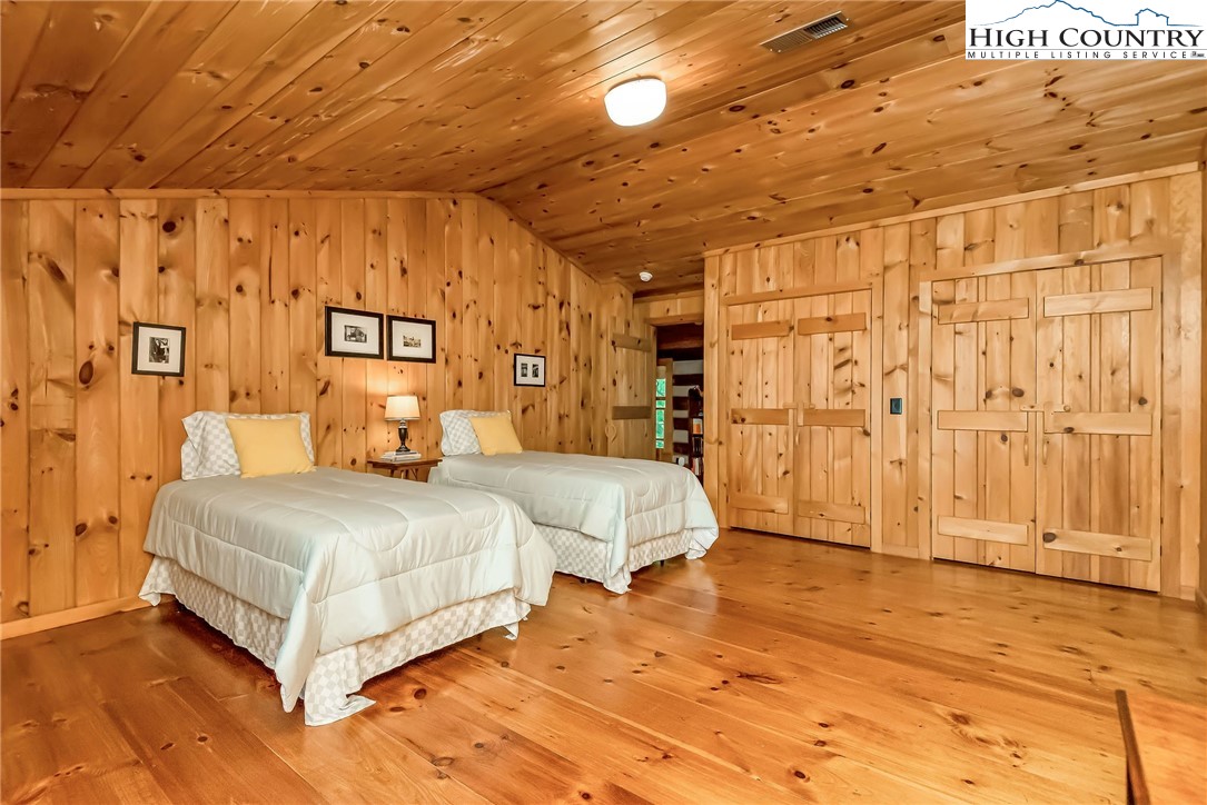1810 Homestead Road Todd, NC 28684 - Photo 29 of 50 a bedroom with a bed and a shower