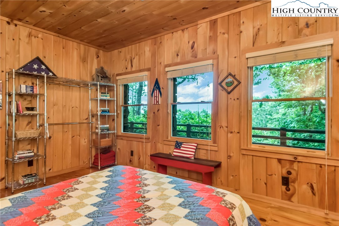 1810 Homestead Road Todd, NC 28684 - Photo 38 of 50 a bedroom with furniture a bed and a window