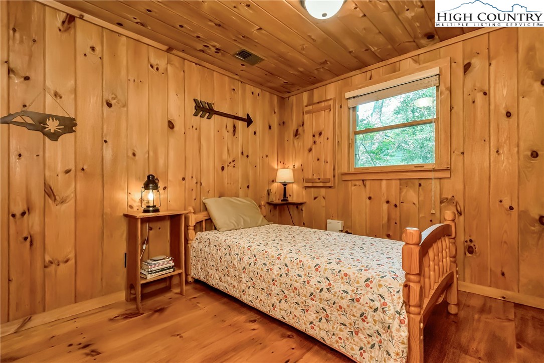 1810 Homestead Road Todd, NC 28684 - Photo 39 of 50 a bedroom with a bed and a table