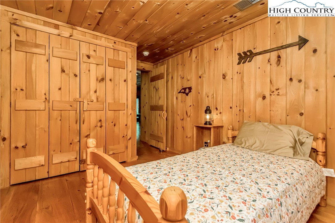 1810 Homestead Road Todd, NC 28684 - Photo 40 of 50 a bedroom with a bed and a shower