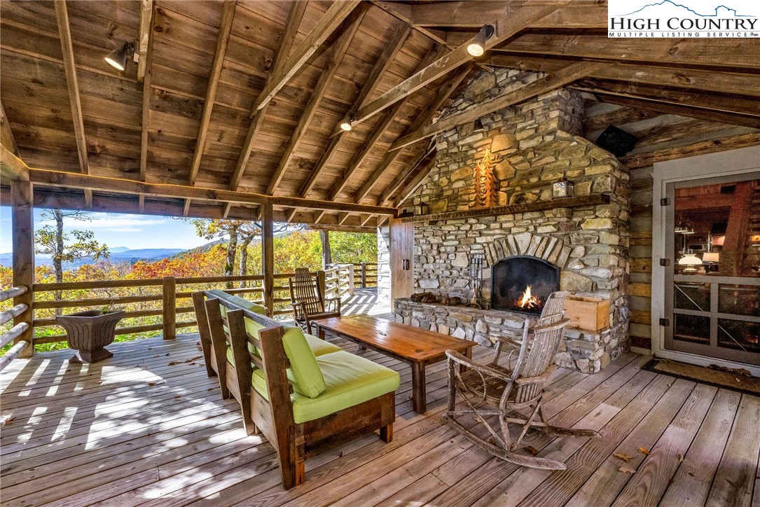 1810 Homestead Road Todd, NC 28684 - Photo 4 of 50 a roof deck with table and chairs