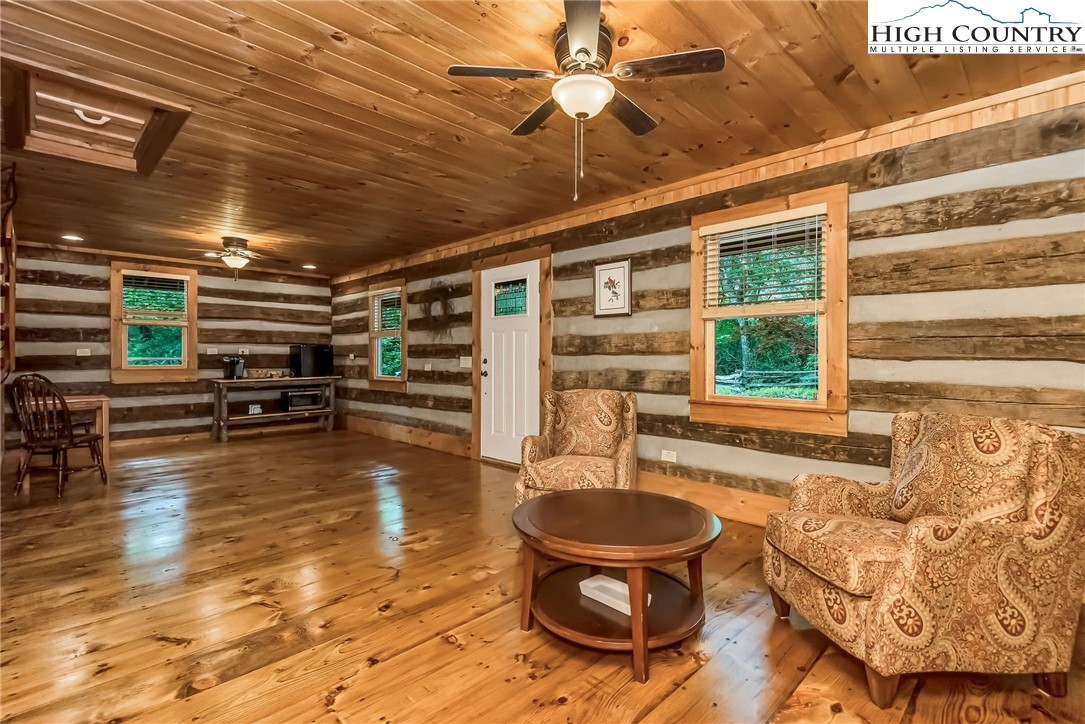 1810 Homestead Road Todd, NC 28684 - Photo 44 of 50 a room with wooden furniture and a table