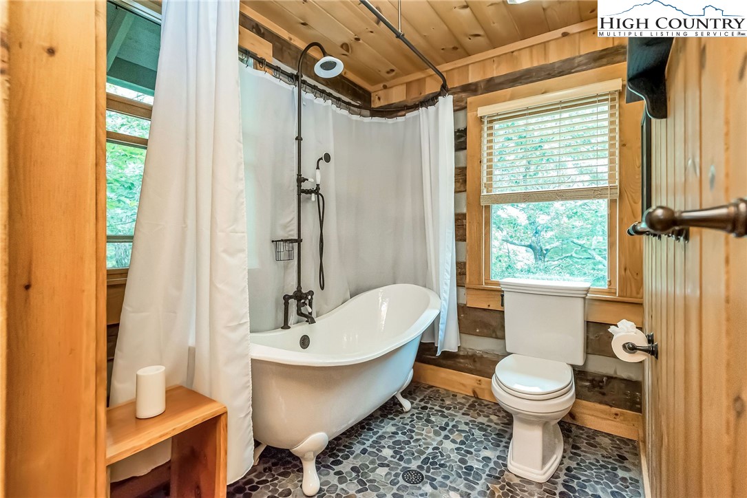 1810 Homestead Road Todd, NC 28684 - Photo 46 of 50 a bathroom with a toilet sink and a shower