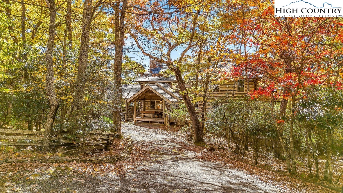 1810 Homestead Road Todd, NC 28684 - Photo 49 of 50 a view of a house with a yard