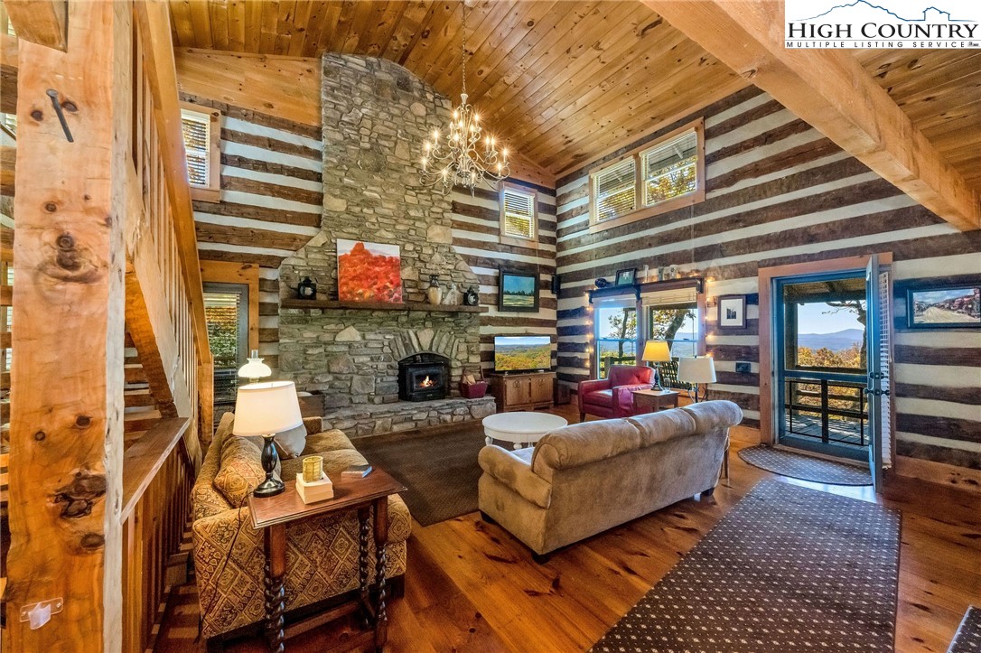 1810 Homestead Road Todd, NC 28684 - Photo 8 of 50 a living room with fireplace furniture and a rug