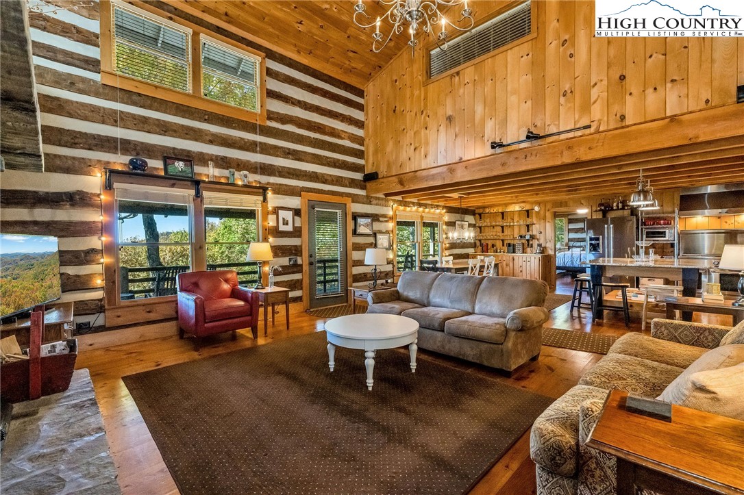 1810 Homestead Road Todd, NC 28684 - Photo 9 of 50 a outdoor living space with a couch and chairs