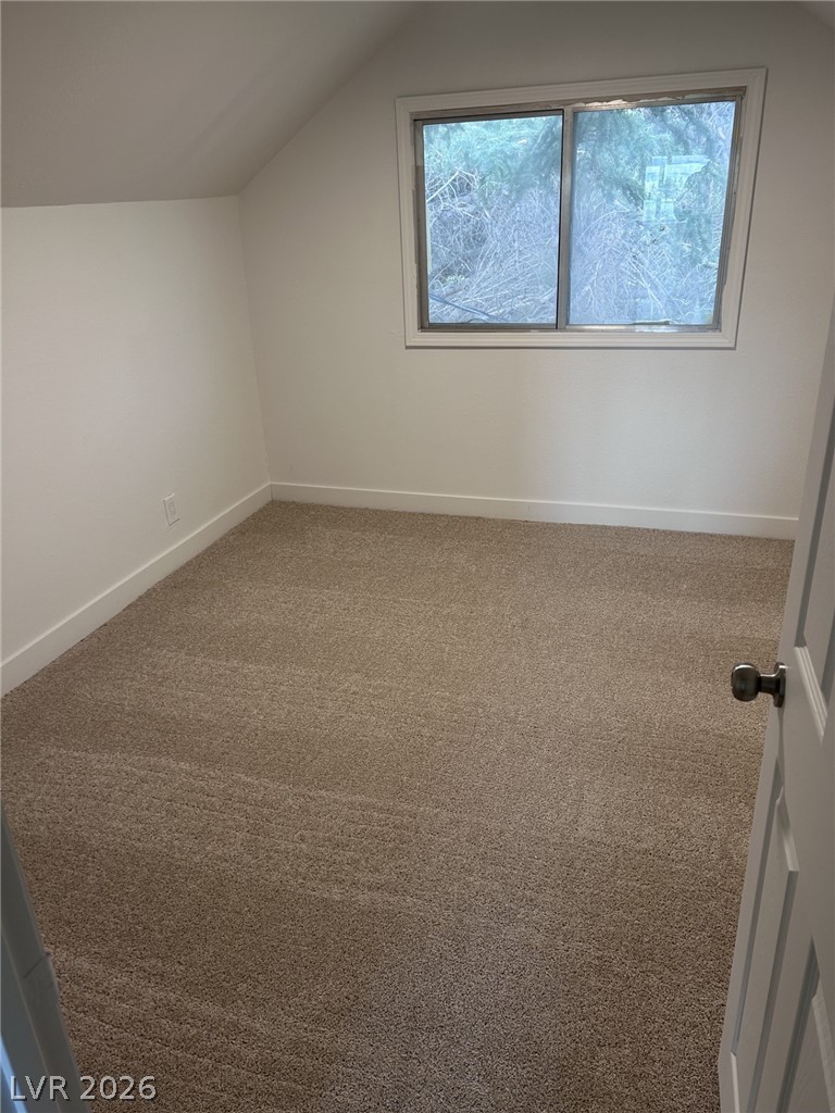 1 Carson Court Ely, NV 89301 - Photo 12 of 20 Up stairs-Bright and airy room with sloped ceilings and ample natural light, ideal for peaceful retreat.