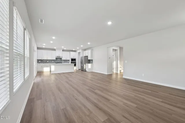 a view of kitchen with wooden floor
