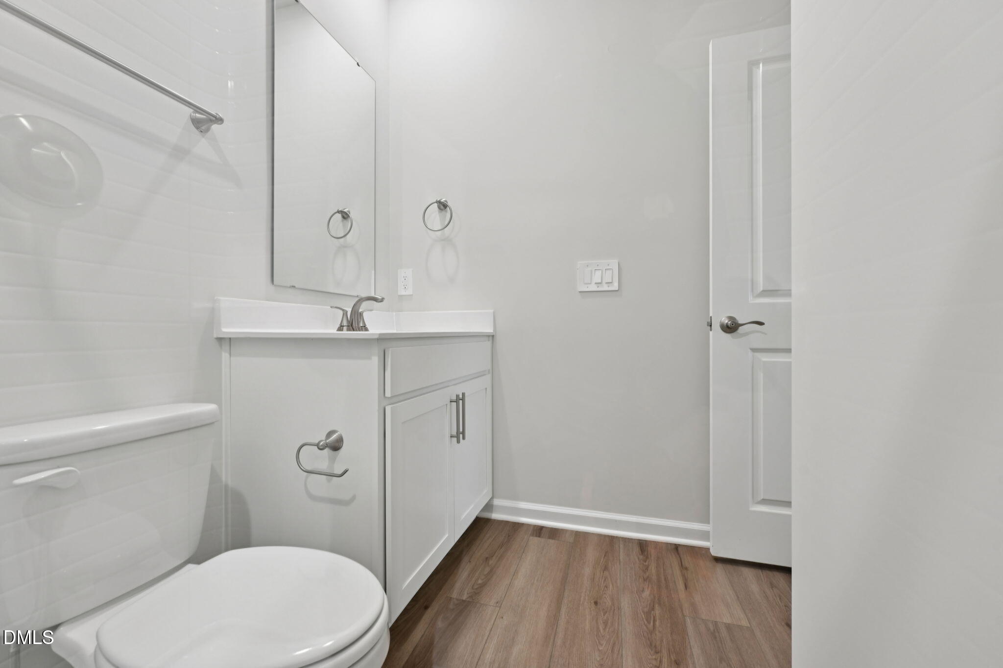 548 Bridger Drive Garner, NC 27529 - Photo 21 of 49 a bathroom with a granite countertop toilet sink and mirror