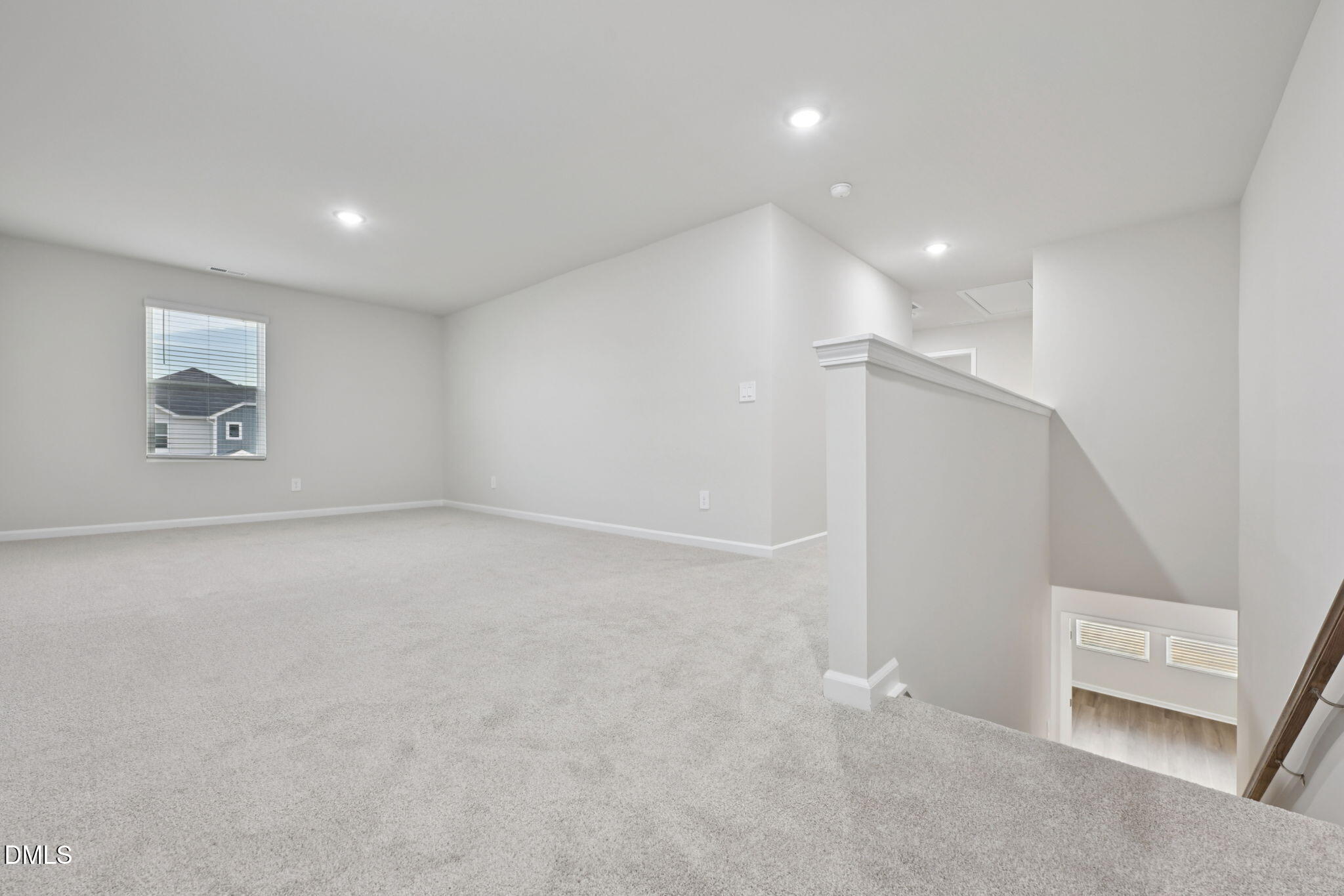548 Bridger Drive Garner, NC 27529 - Photo 22 of 49 an empty room with a empty space and windows