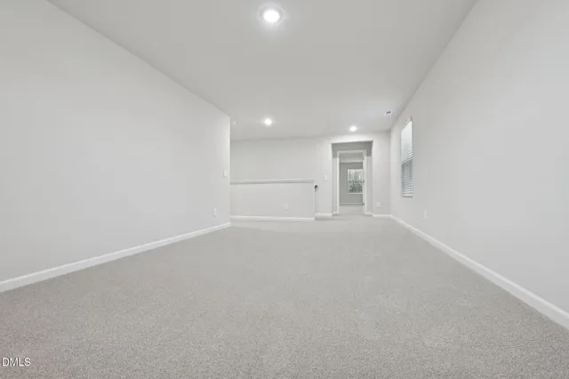 an empty room with a empty space and window