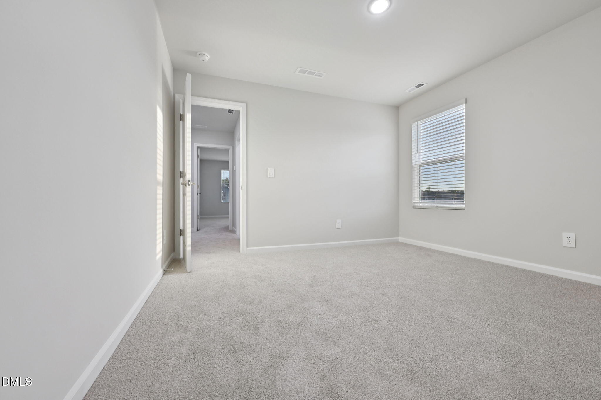 548 Bridger Drive Garner, NC 27529 - Photo 26 of 49 an empty room with windows and closet