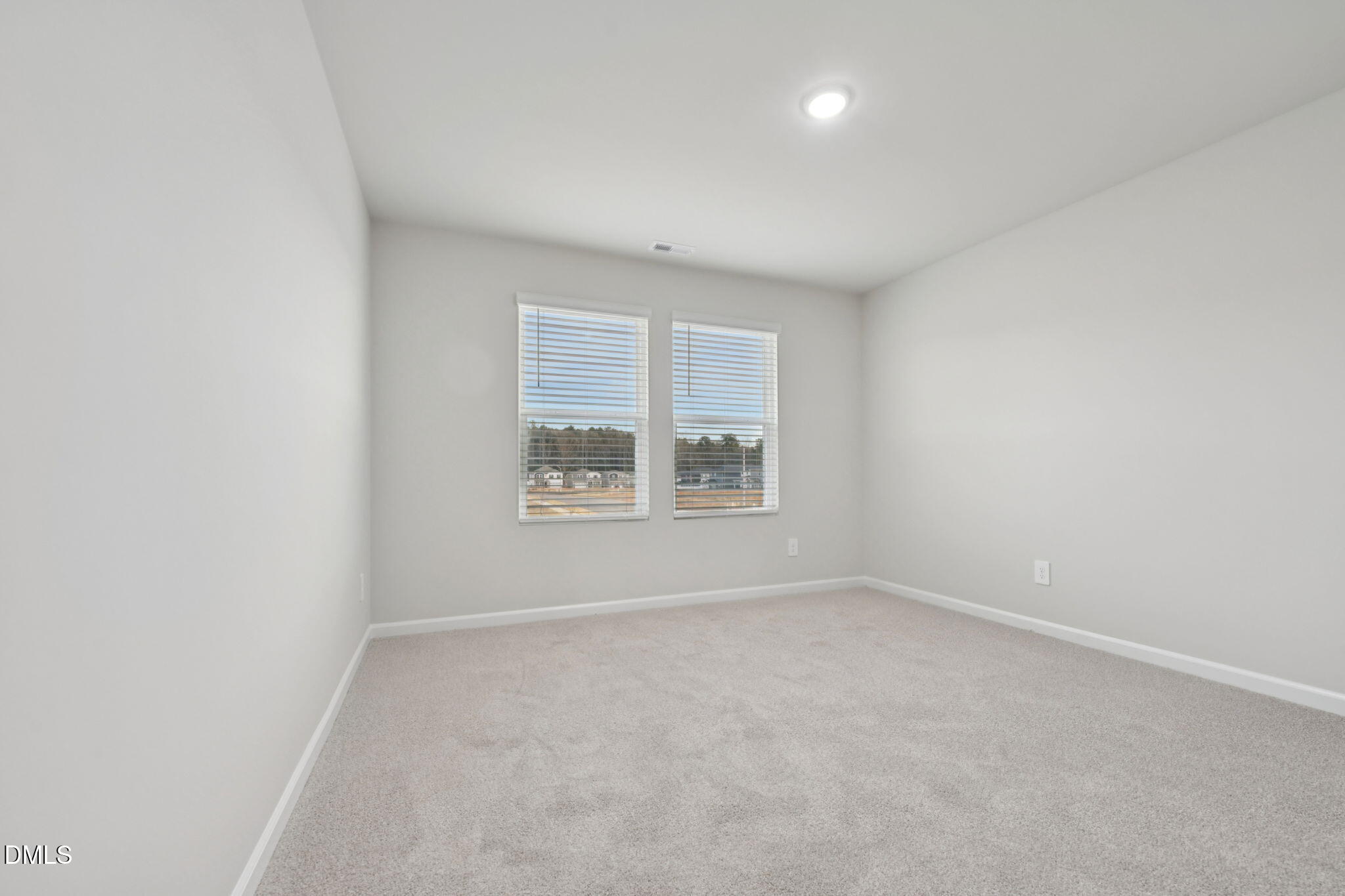 548 Bridger Drive Garner, NC 27529 - Photo 27 of 49 an empty room with windows