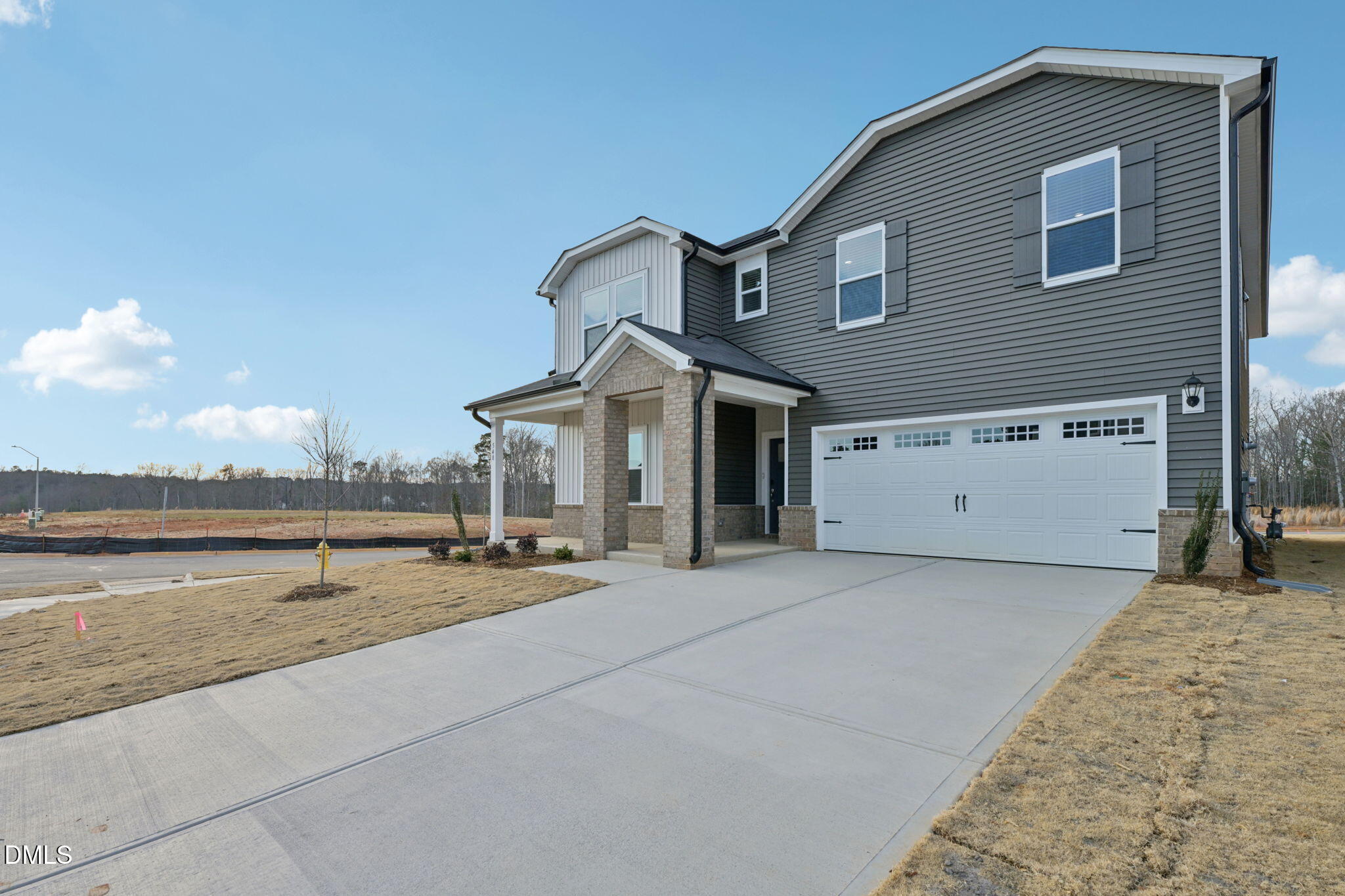548 Bridger Drive Garner, NC 27529 - Photo 2 of 49 a view of a house with a ocean view and car parked