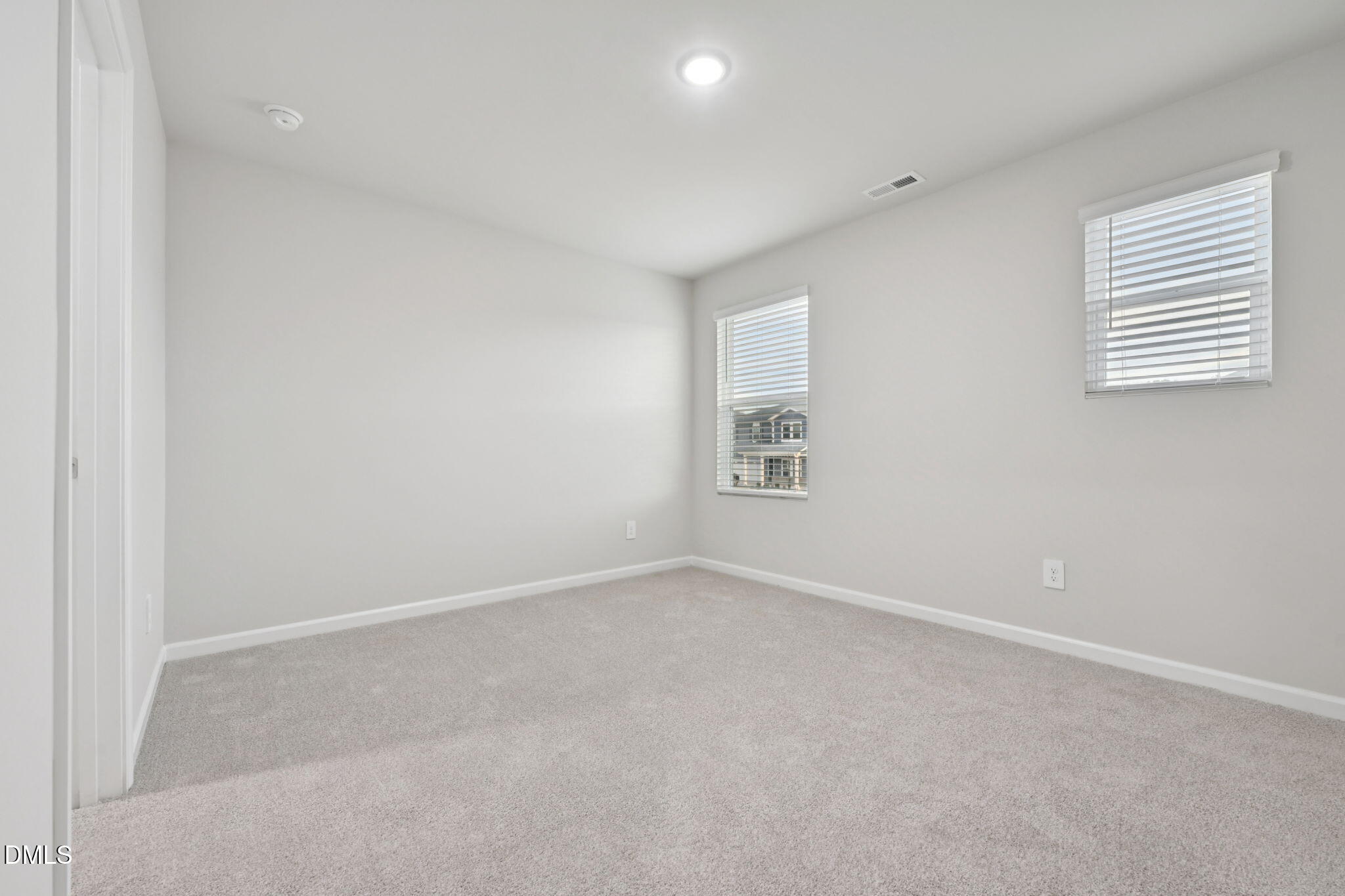 548 Bridger Drive Garner, NC 27529 - Photo 29 of 49 an empty room with windows