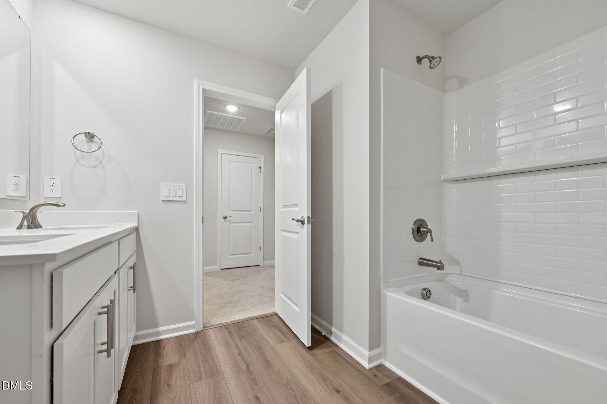548 Bridger Drive Garner, NC 27529 - Photo 35 of 49 a bathroom with a tub sink and mirror