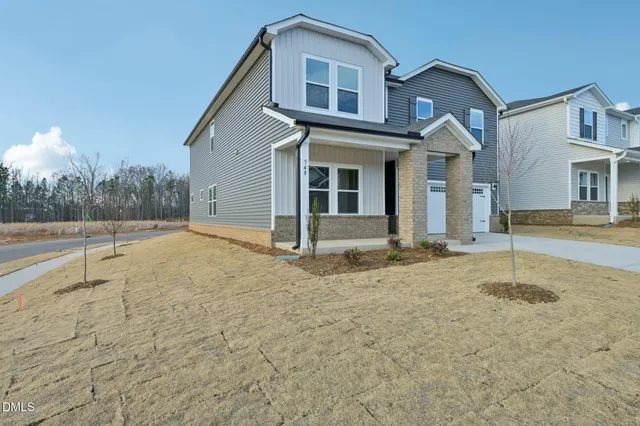 a view of a house with a dry yard