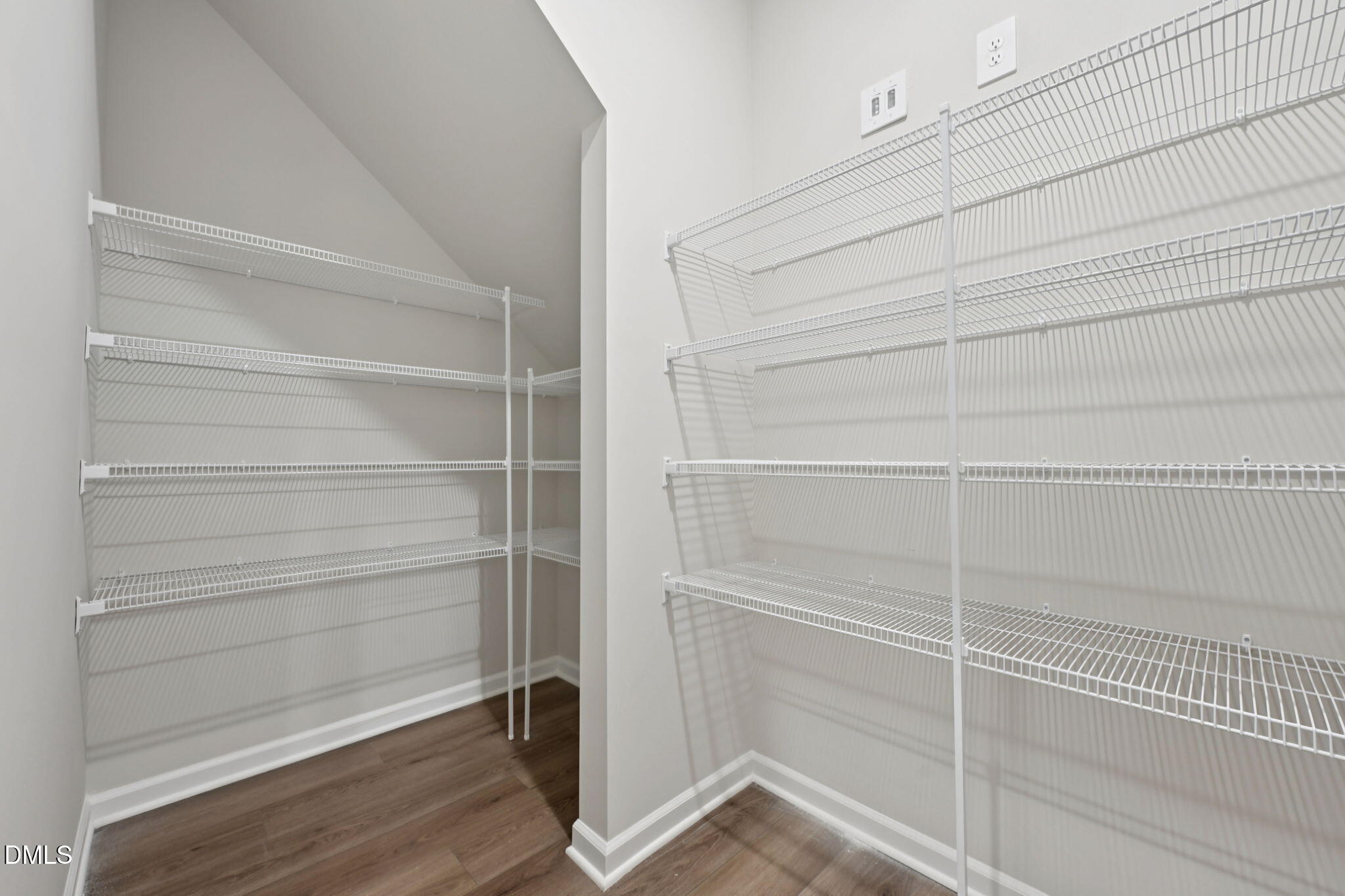 548 Bridger Drive Garner, NC 27529 - Photo 40 of 49 a view of walk in closet with empty racks