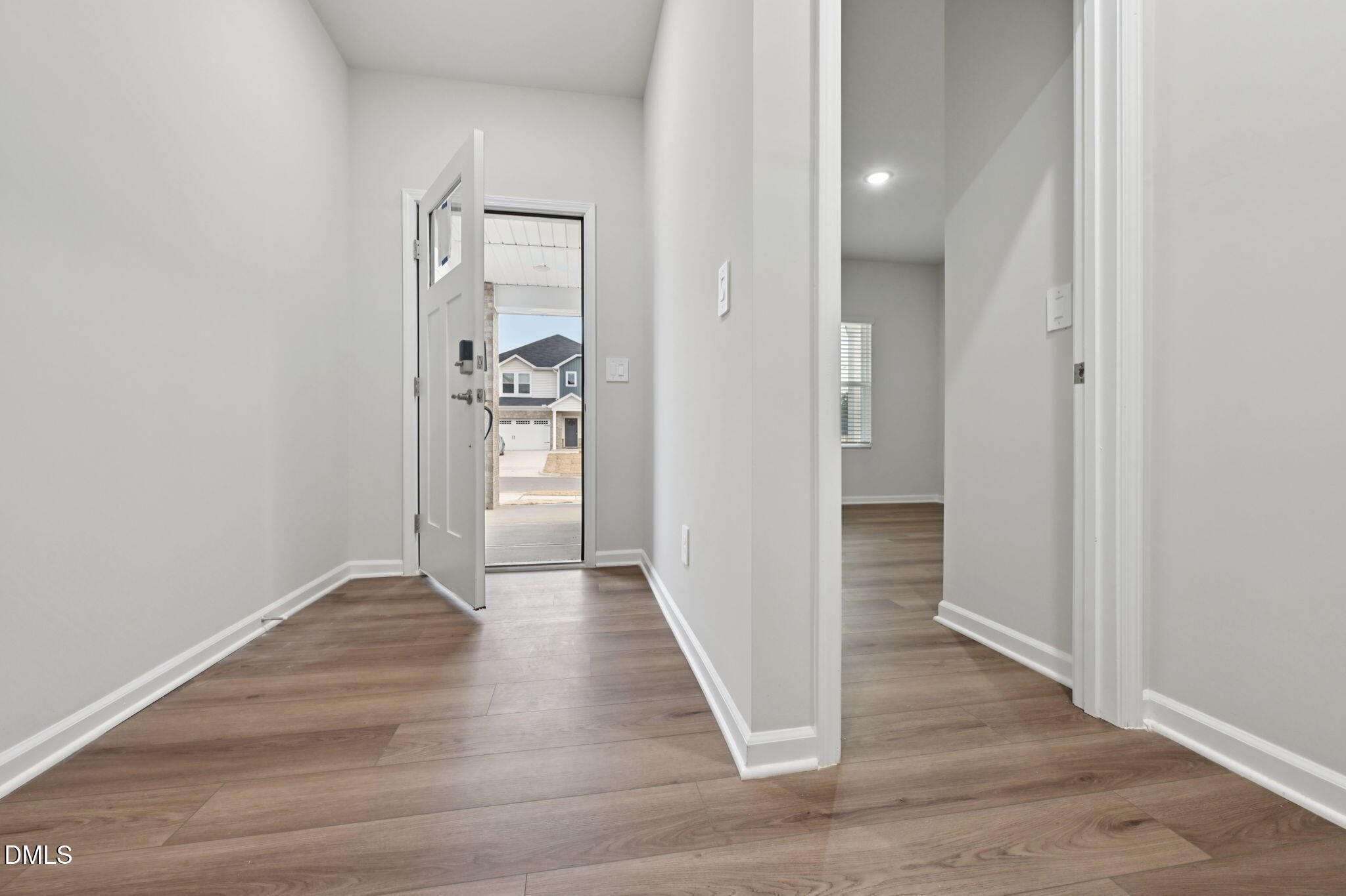 548 Bridger Drive Garner, NC 27529 - Photo 7 of 49 a view of a hallway with wooden floor