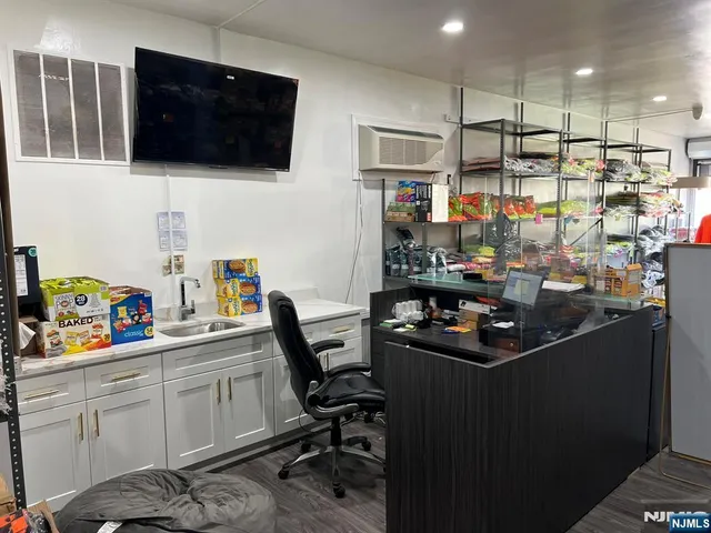 a view of a workspace with furniture