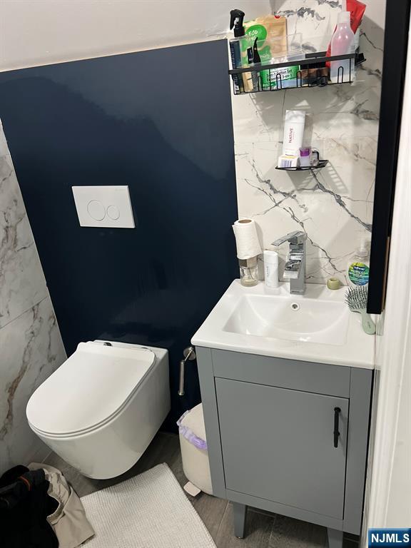 460 Boulevard Hasbrouck Heights, NJ 07604 - Photo 8 of 11 a bathroom with a sink and a mirror