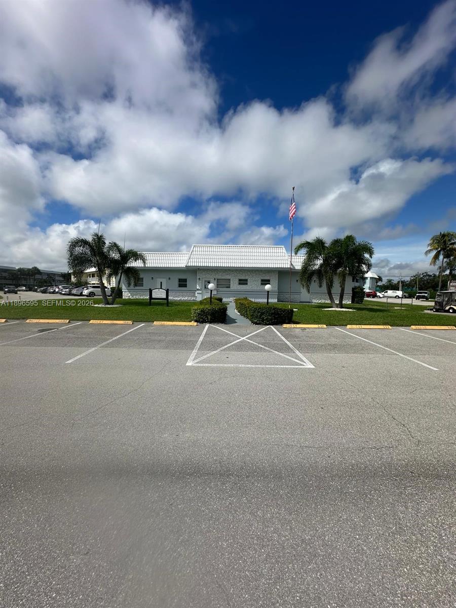 9848 Marina Boulevard, Unit 811 Boca Raton, FL 33428 - Photo 80 of 86 In front of the Clubhouse