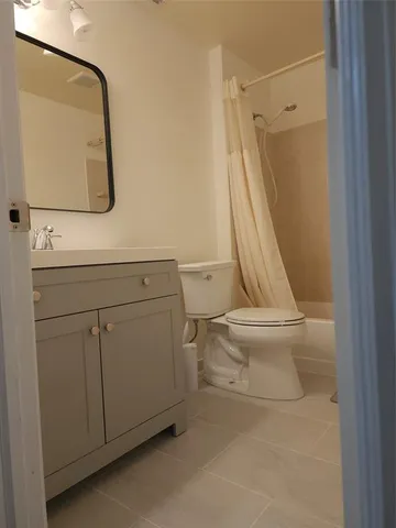 a white toilet sitting next to a bathroom