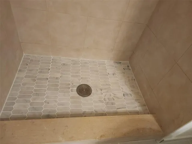 a bathroom with a sink and a shower
