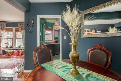 a living room with furniture flowerpot and window