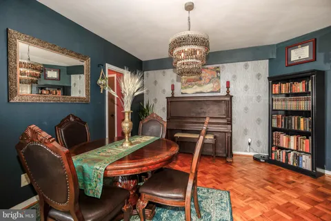 a view of a livingroom with furniture and chandelier