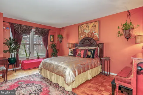 a bedroom with a large bed and a window