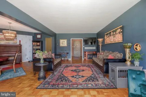 a living room with furniture and a rug