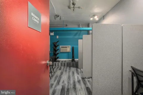 a view of kitchen with wooden floor