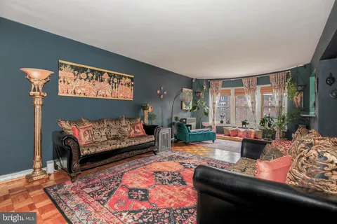 a living room with furniture rug and window
