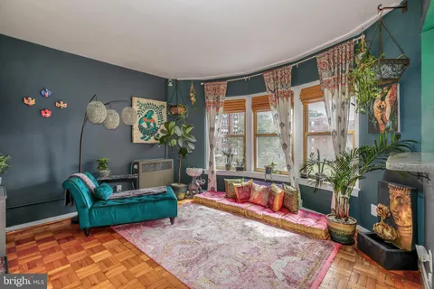 a living room with furniture fireplace and flat screen tv