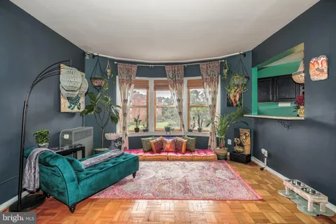 a living room with furniture and a large window