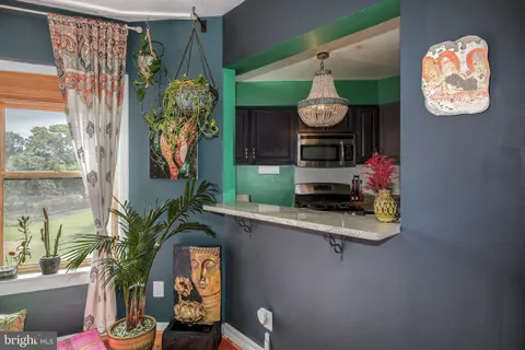 a dining room with furniture and window