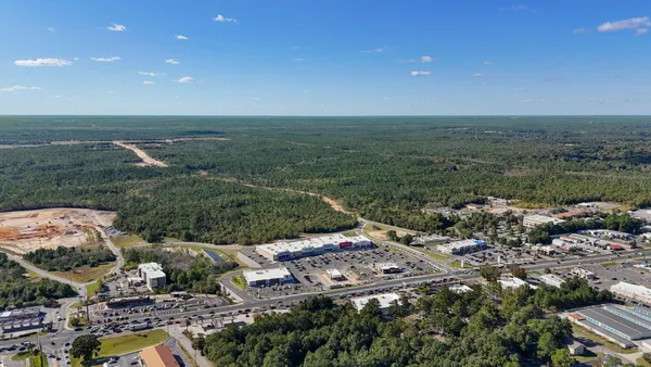 a view of a field with an ocean