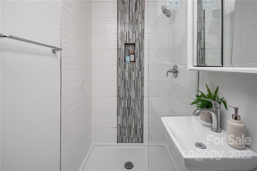 3532 Clardy Court Charlotte, NC 28205 - Photo 24 of 34 a bathroom with a shower and a sink