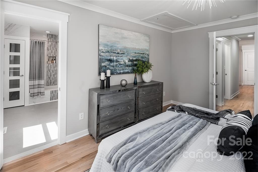 3532 Clardy Court Charlotte, NC 28205 - Photo 27 of 34 a bedroom with a bed and a dresser next to a window