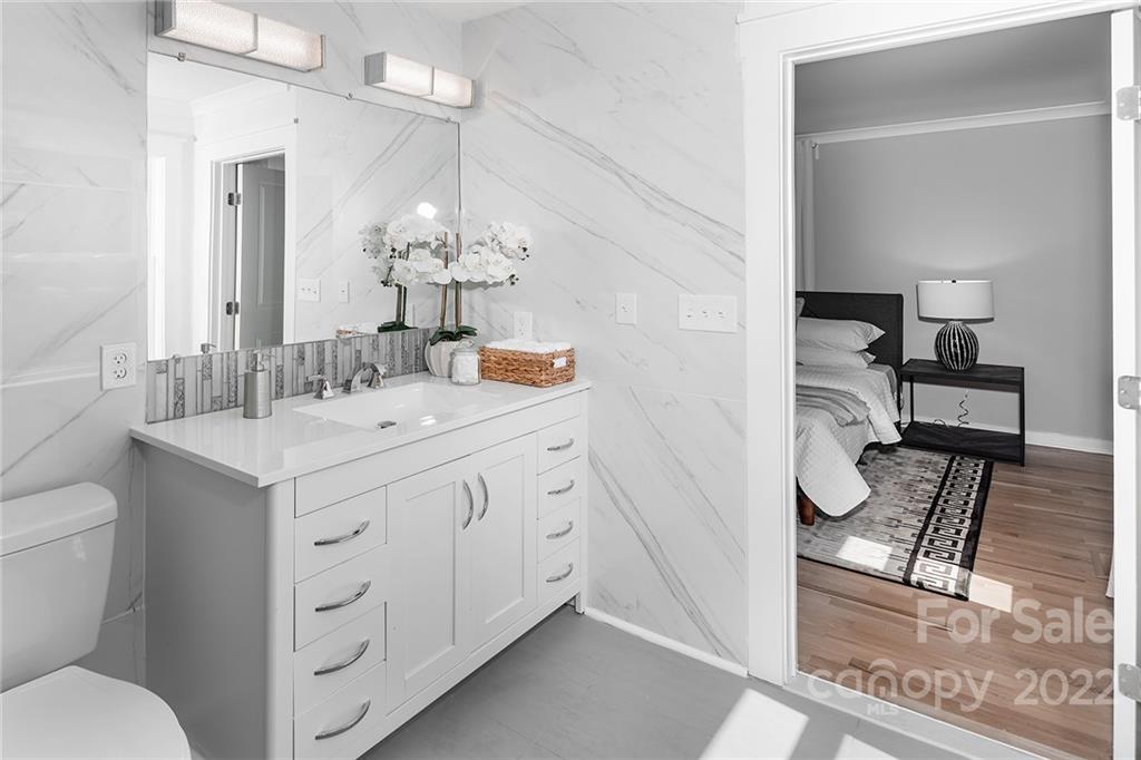 3532 Clardy Court Charlotte, NC 28205 - Photo 29 of 34 a bathroom with a sink a toilet and a mirror