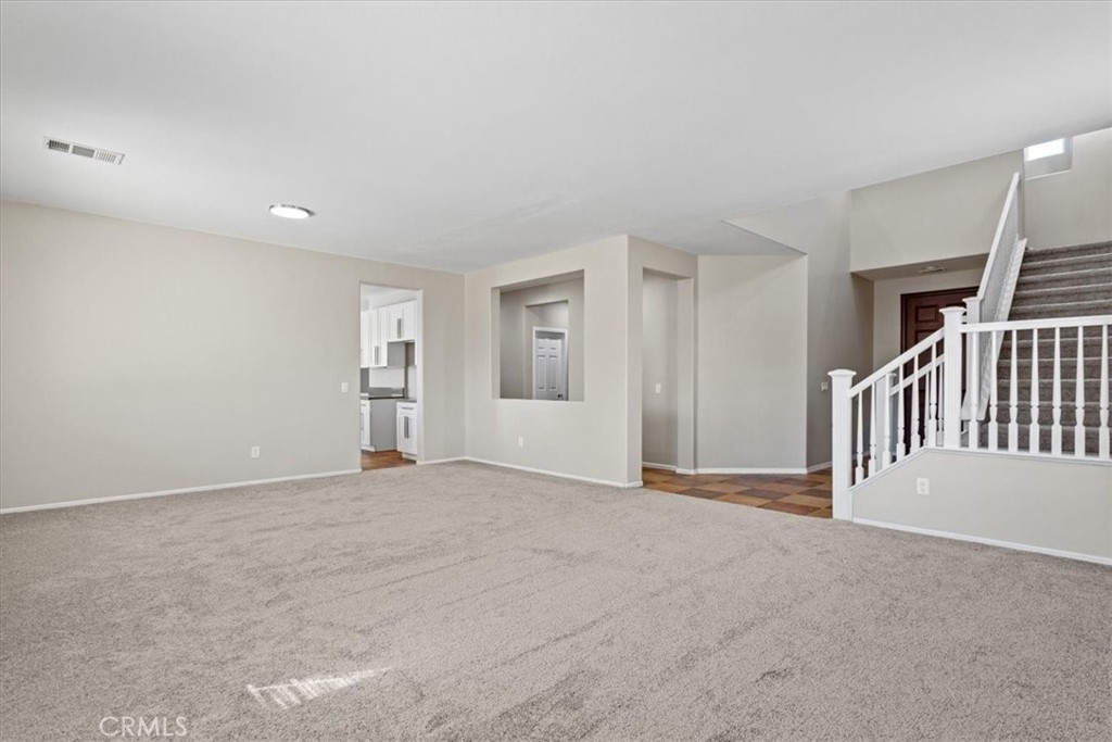 1128 East E Avenue Lancaster, CA 93535 - Photo 11 of 37 a view of an empty room with stairs