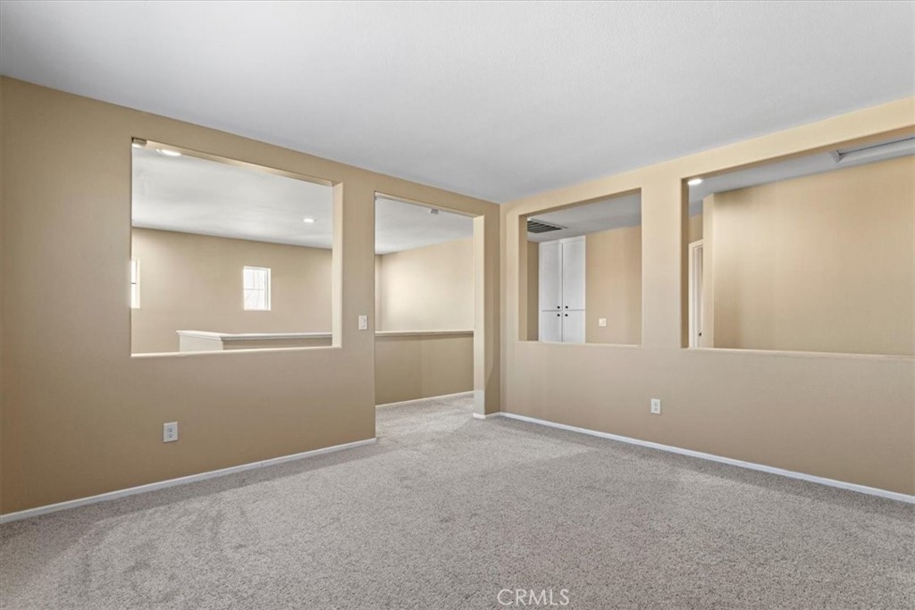 1128 East E Avenue Lancaster, CA 93535 - Photo 13 of 37 a view of an empty room with window and closet area