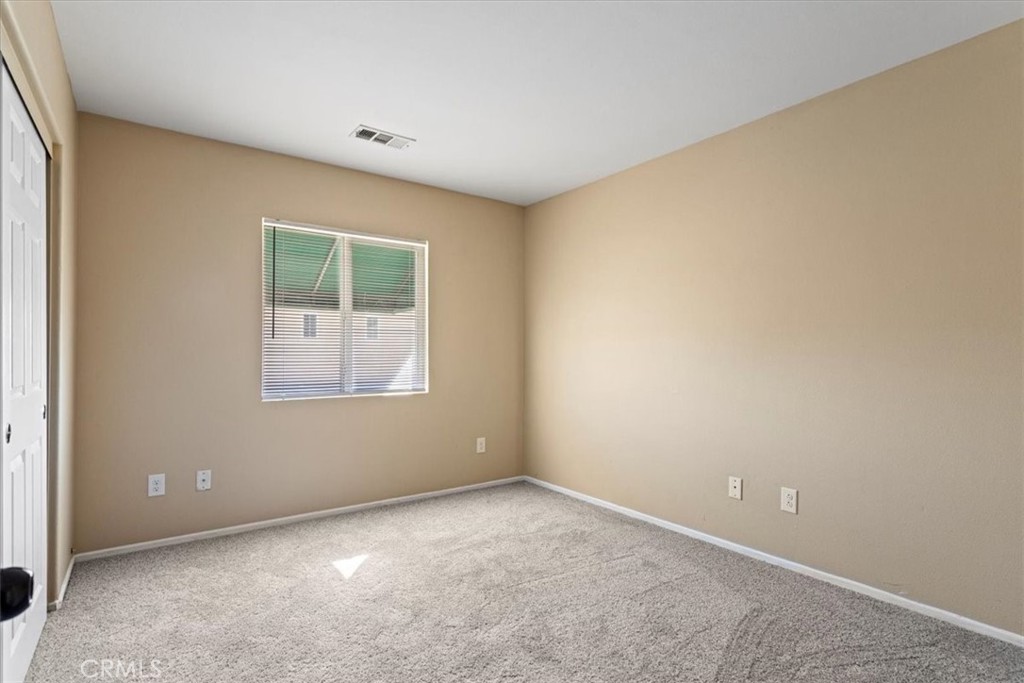 1128 East E Avenue Lancaster, CA 93535 - Photo 16 of 37 an empty room with windows